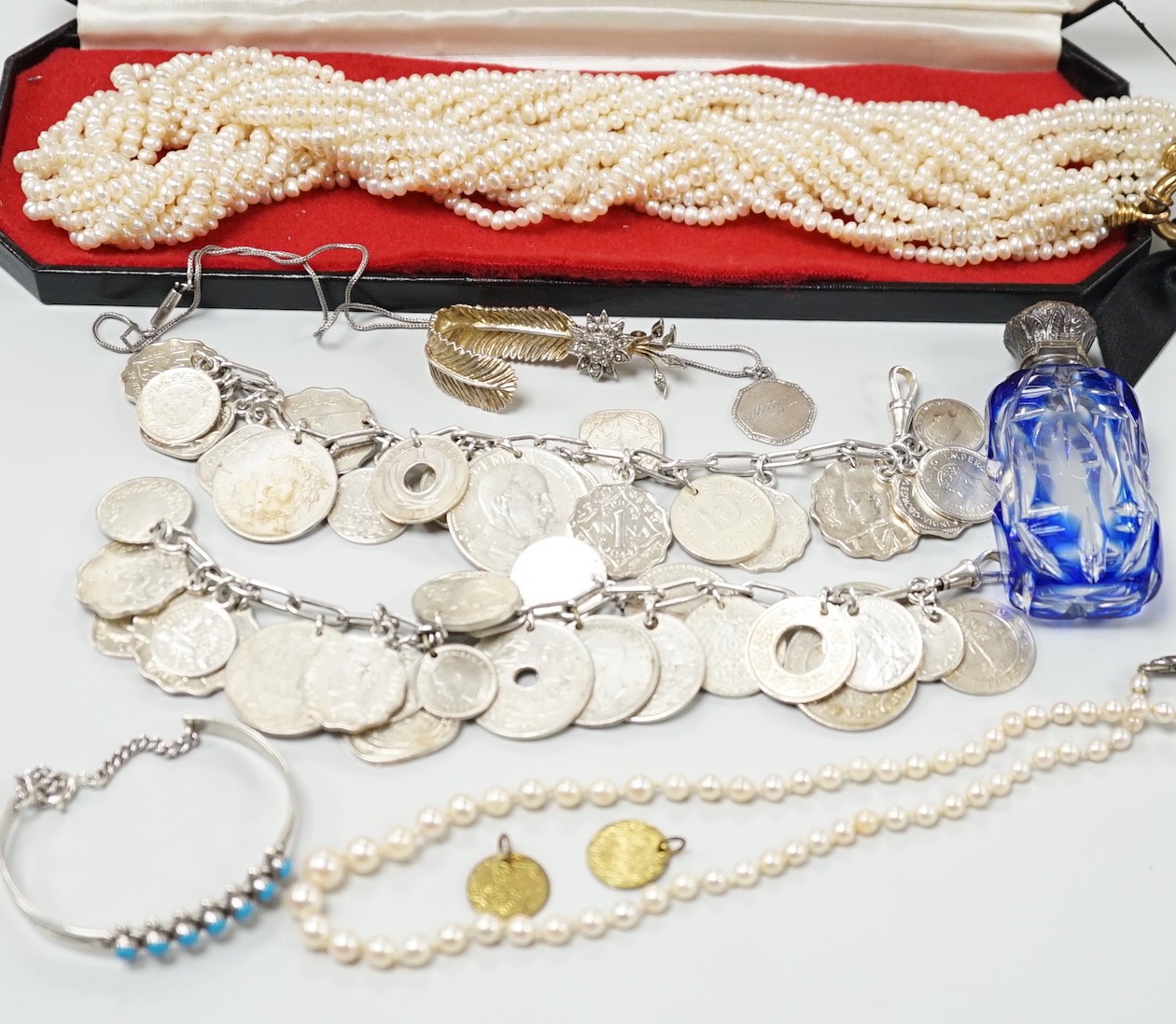 Mixed jewellery including a modern freshwater? pearl torsade necklace, 52cm, a Christian Dior 58 paste set brooch, two coin bracelets, a single strand cultured pearl necklace, mounted glass scent bottle, etc.